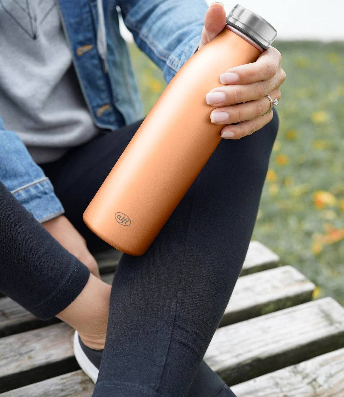 pure bottle orange woman jeans outside